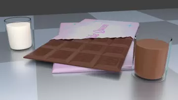 Bar of chocolate, a glass of cocoa and milk